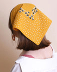 Yellow dotted and floral bandana by Leto Collection featuring vibrant patterns and lightweight fabric.