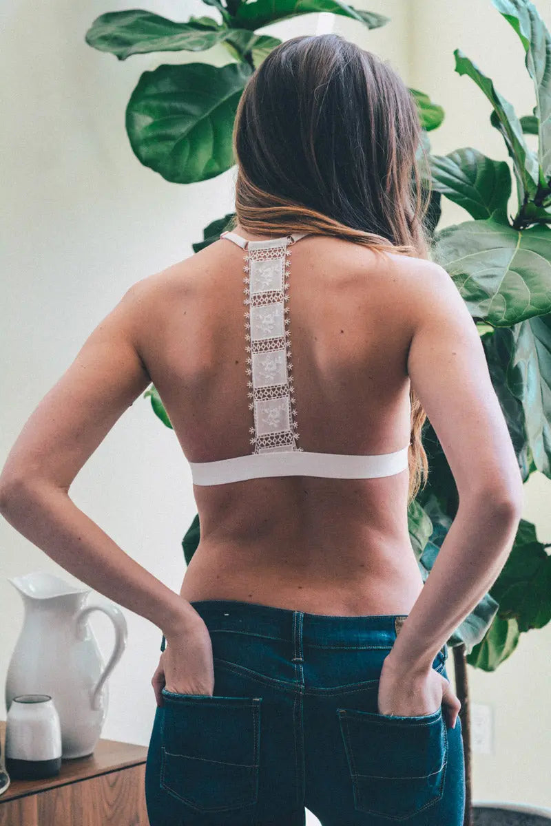 White crochet T-back bralette by Leto Collection, featuring delicate crochet details and a comfortable fit.