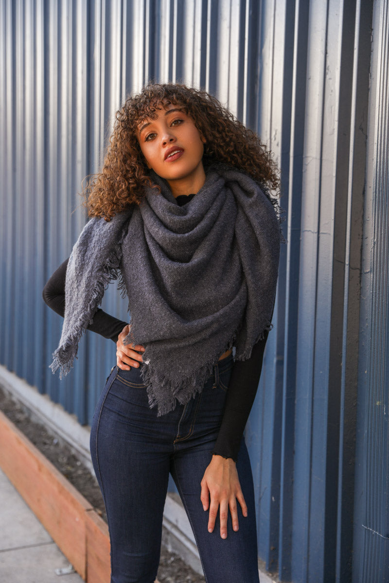 Leto Collection mohair square scarf in blue with soft, textured fabric, stylishly folded to showcase its square shape.
