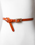 Adjustable skinny waist camel belt with sleek gold clasp.