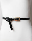 Black versatile gold buckle belt for dresses and casual wear.