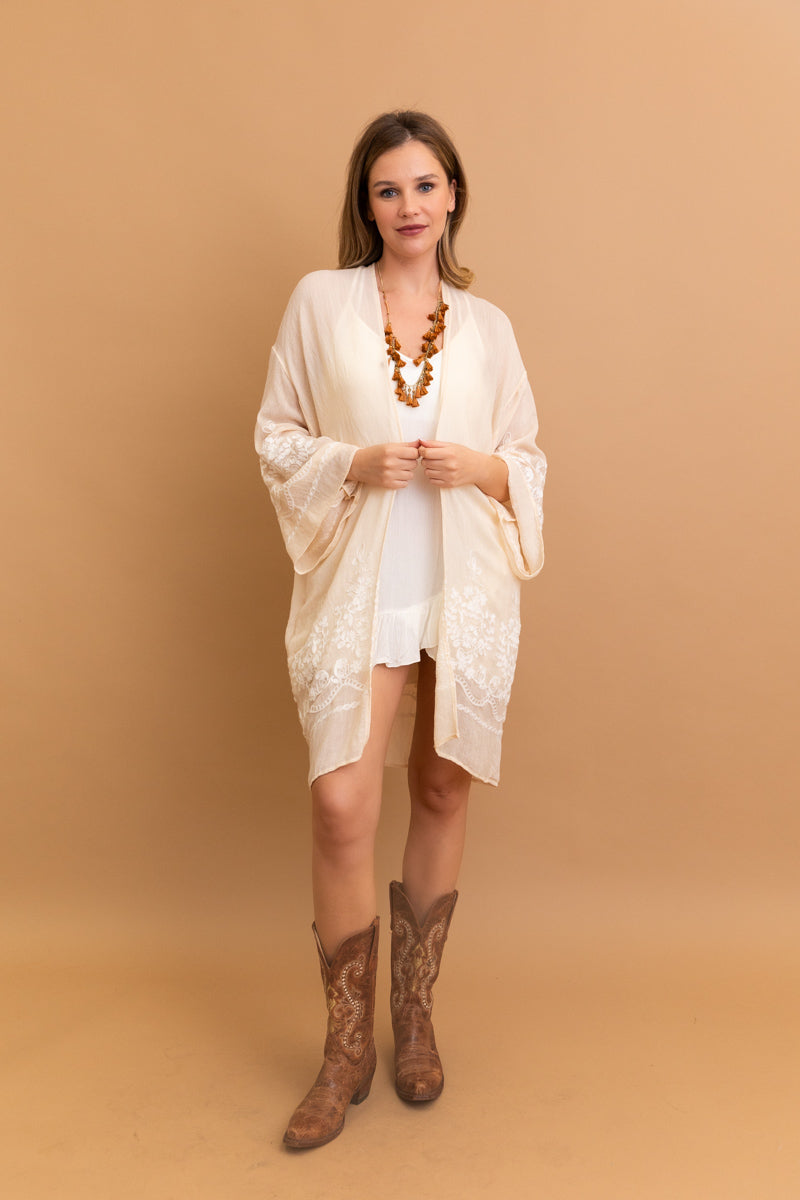 Blossom Breeze embroidered cream kimono with floral design.
