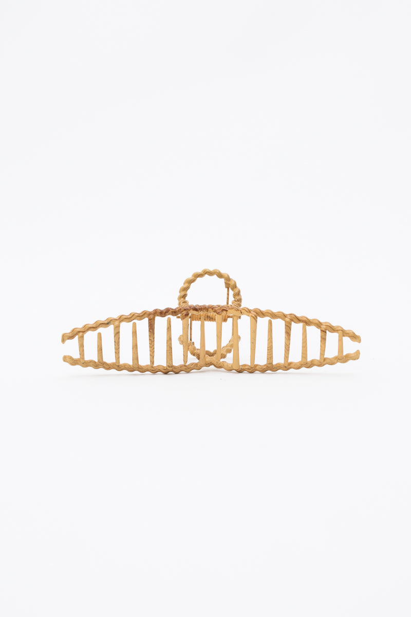 Braided metal hair clip with elegant wood grain finish.