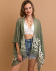 Breathable sage floral embroidered kimono with viscose polyester blend.