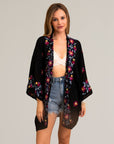 Chic ethereal anemone black kimono with sophisticated floral details.