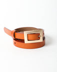 Classic skinny camel leather belt with stylish gold accent.