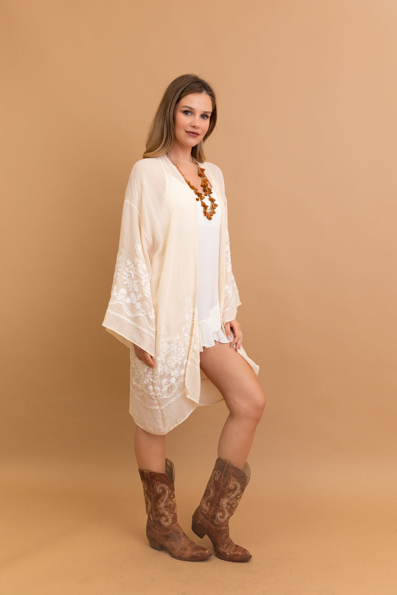 Elegant Blossom Breeze cream kimono with intricate embroidery.