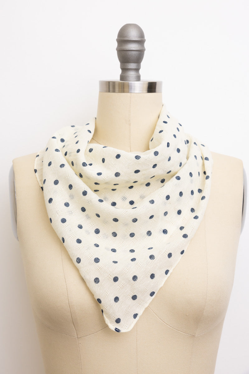 Elegant light printed dot scarf featuring a small pattern design.