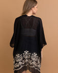 Floral embroidery black kimono for layering and style.