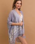 Floral patterned blue kimono with detailed embroidery and comfort.