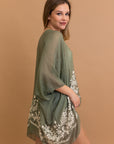 Lightweight floral embroidered sage kimono with detailed stitching.
