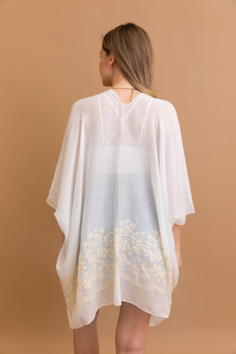 Open-front floral white kimono with elegant design.