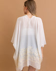 Open-front floral white kimono with elegant design.