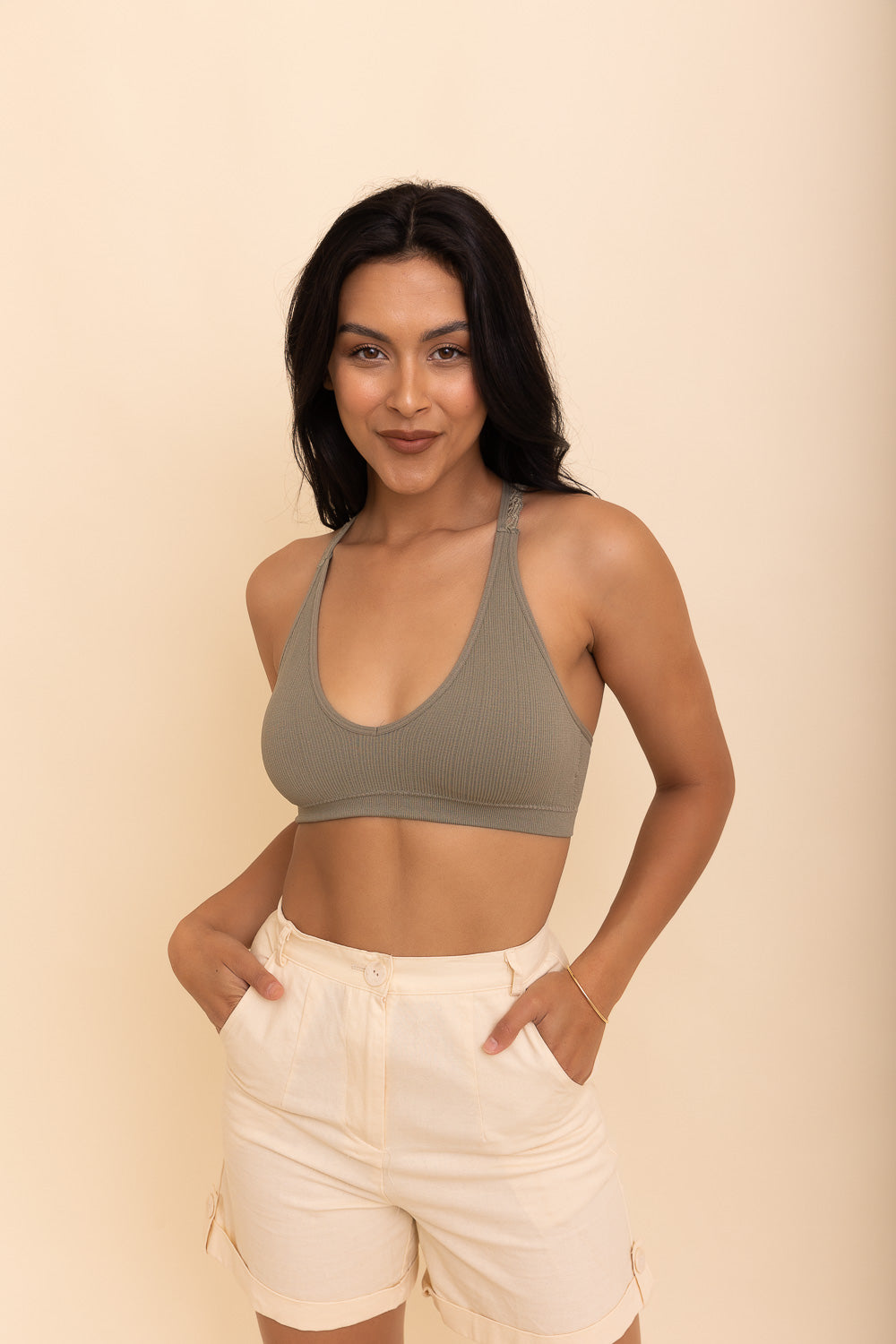 Racerback lace sage bralette with seamless and wireless comfort.