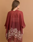 Rosewood floral embroidered kimono crafted with viscose and polyester.