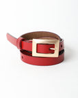 Slim waist red belt with gold buckle for versatile styles.