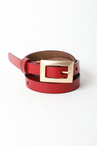 Slim waist red belt with gold buckle for versatile styles.