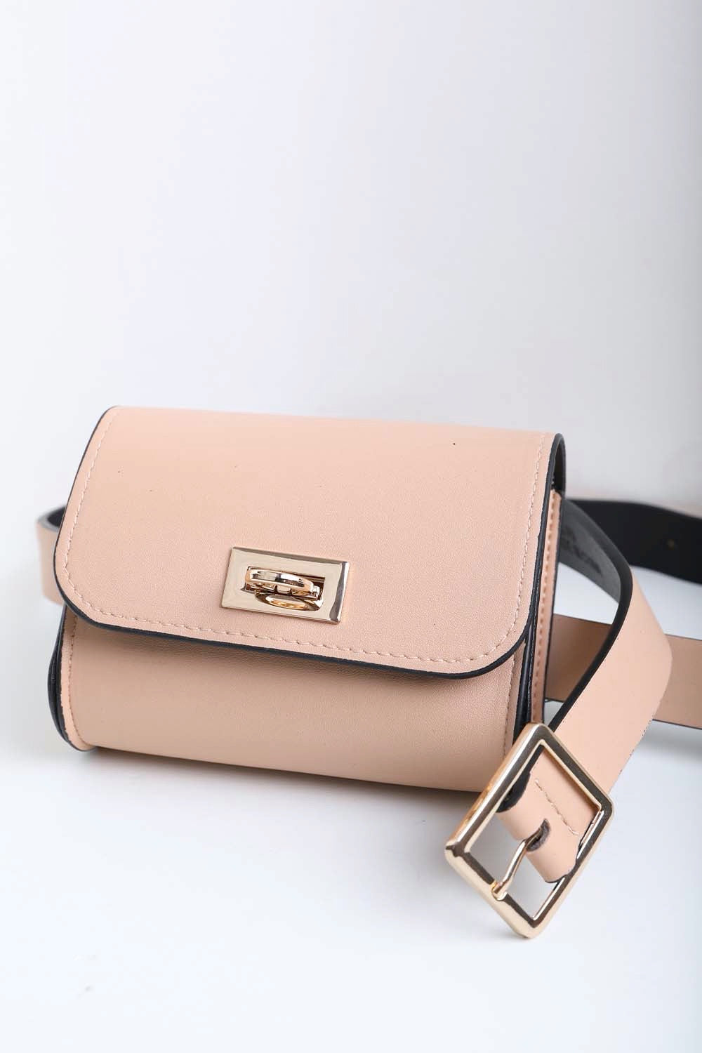 Small nude vegan leather waist bag with durable design.