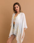 Sophisticated embroidered white kimono with detailed floral pattern.