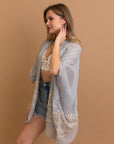 Stylish embroidered smoke kimono wrap with intricate floral design.