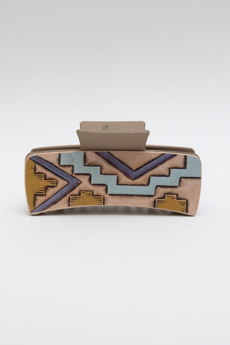 Western hair claw clip with a geometric tribal design and secure grip for styling.