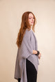 Acrylic gray ribbed ruana, soft knit shawl ideal for layering and comfort.