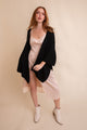 Black Chic ridged rib knit ruana wrap suitable for both casual and formal ensembles.