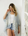 Breathable and versatile smoke floral kimono with intricate embroidery.