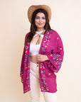 Breathable anemone floral fuchsia kimono with open-front design.