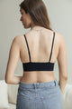 Breathable lace black brami with decorative loop waistband for layering.