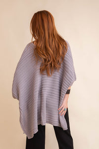 Cozy knit gray ruana with ribbed texture and open front, perfect for effortless layering.