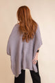 Cozy knit gray ruana with ribbed texture and open front, perfect for effortless layering.