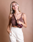 Elegant burgundy mini waist belt bag made with faux leather.