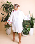 Elegant floral embroidered white kimono with sophisticated details.