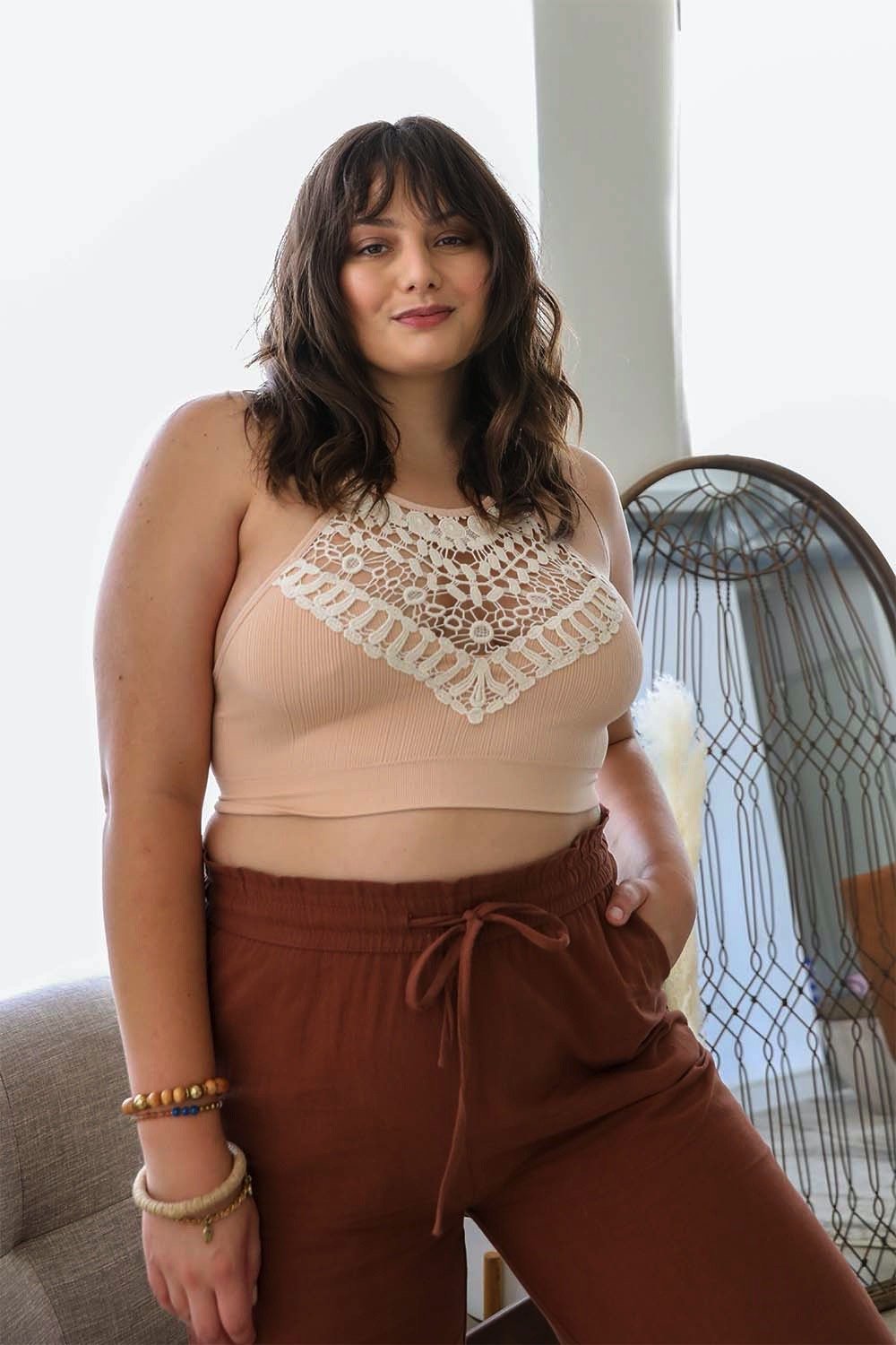 Elegant plus size blush bralette with crochet lace and halter neck.