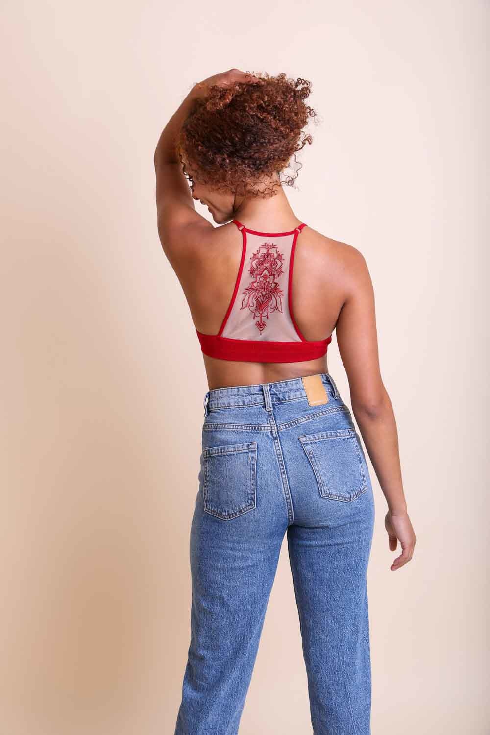 Embroidered mesh red racerback bralette with tattoo-inspired design.