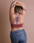 Feminine tattoo back rust bralette with mesh racerback style.