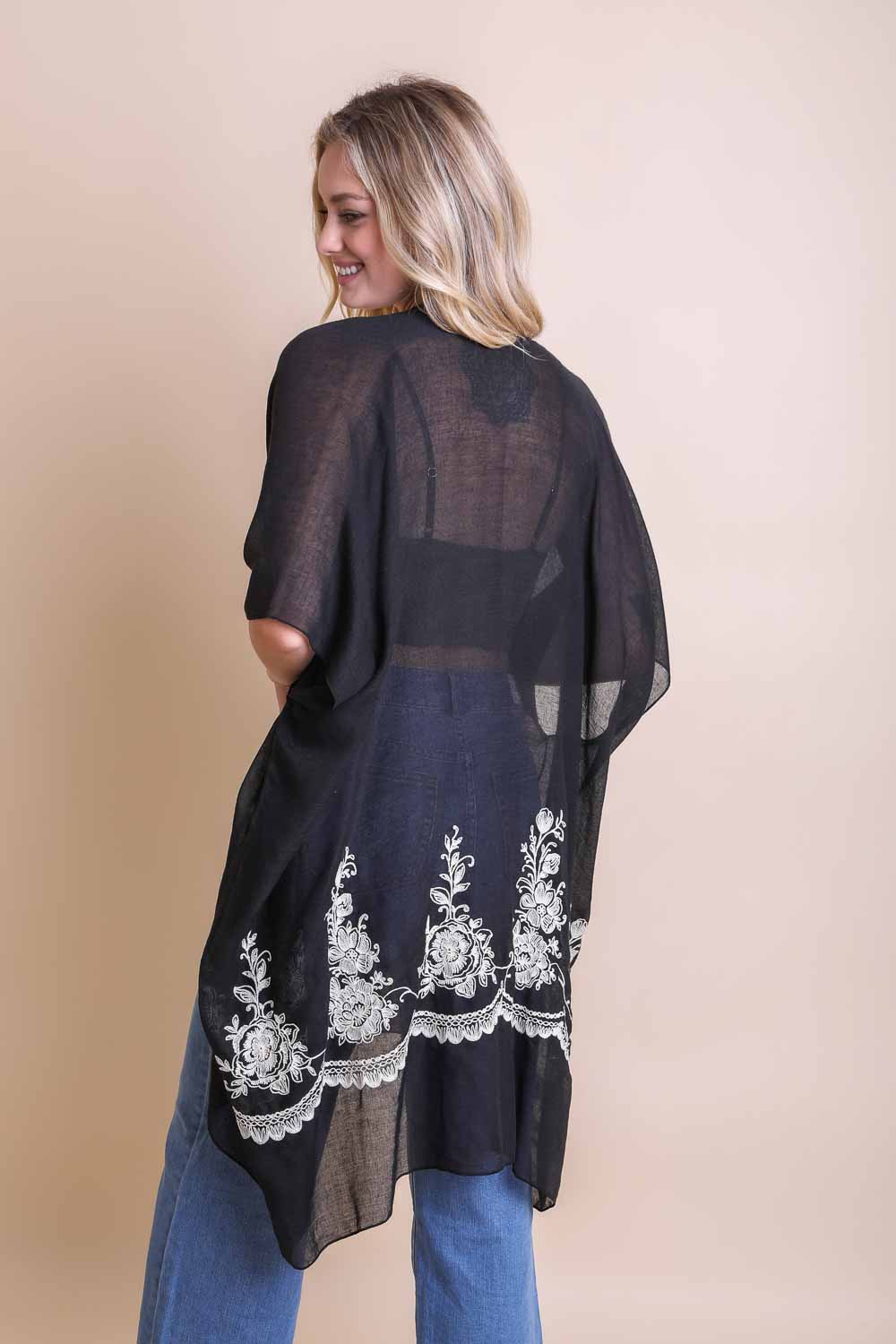 Floral embroidered black kimono crafted with viscose and polyester blend.