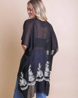 Floral embroidered black kimono crafted with viscose and polyester blend.