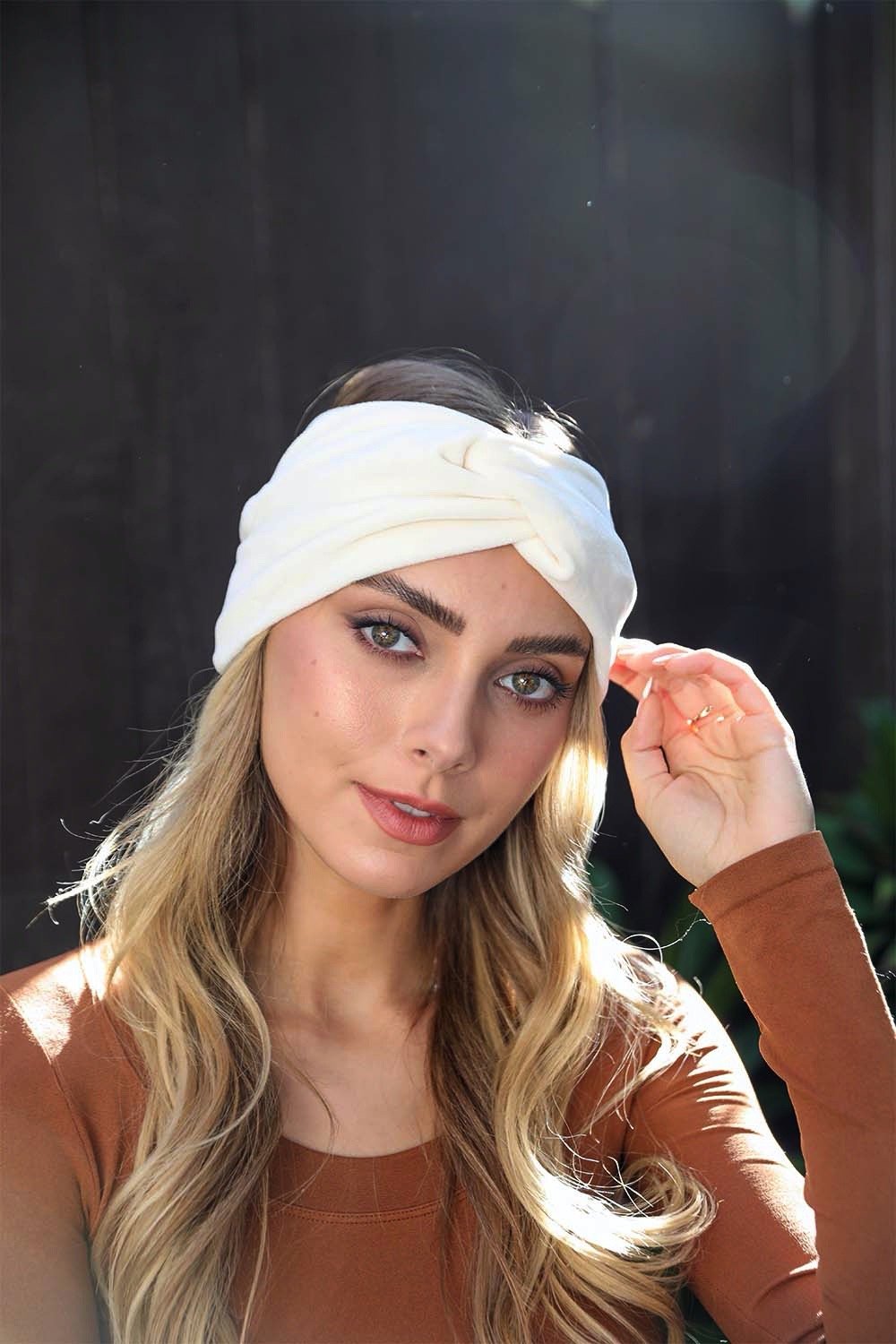 Imported ivory soft twisted headbands with elegant knot design.