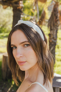 Lightweight and comfortable floral embroidered knot ivory headband.