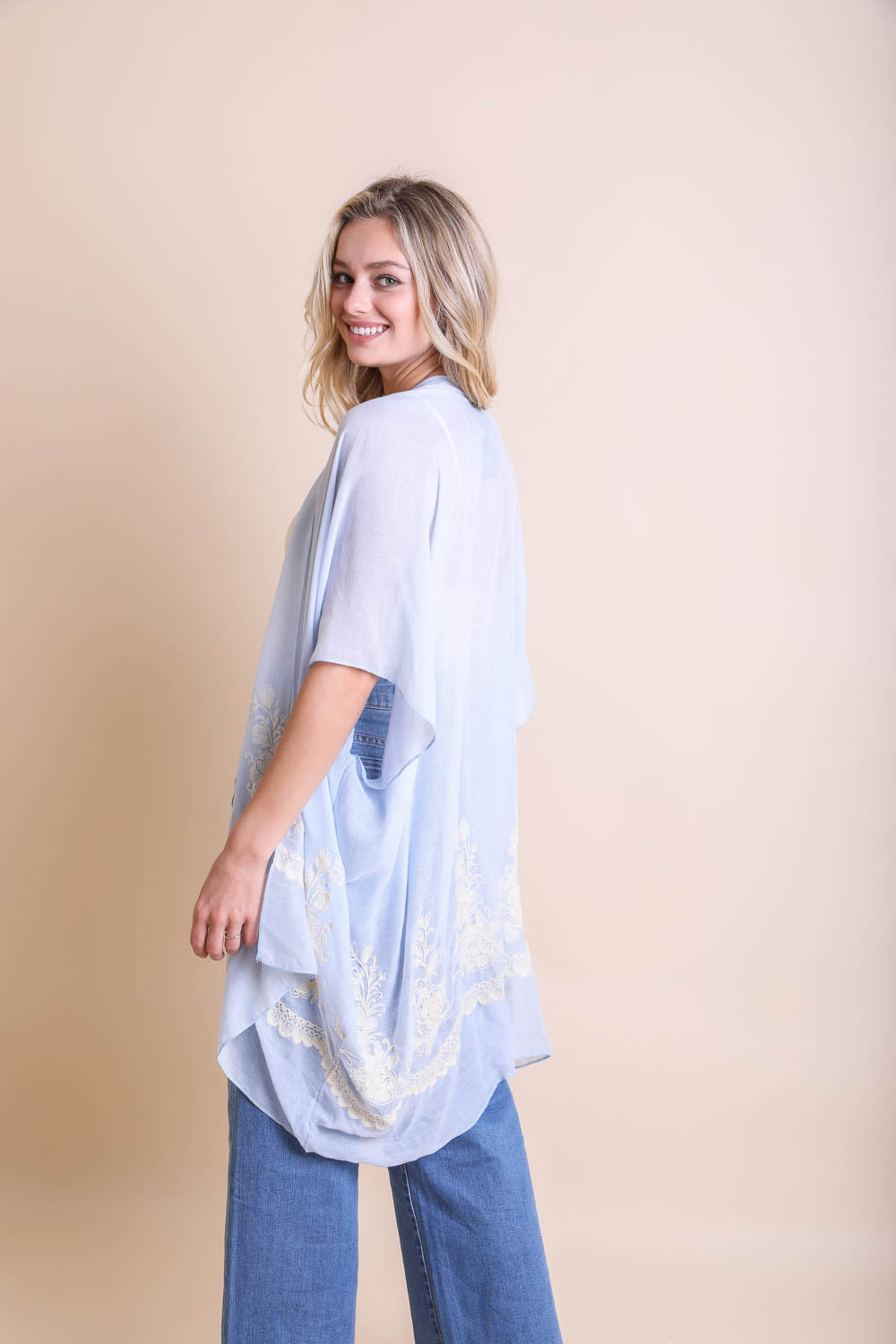 Lightweight embroidered stitch blue kimono suitable for any occasion.