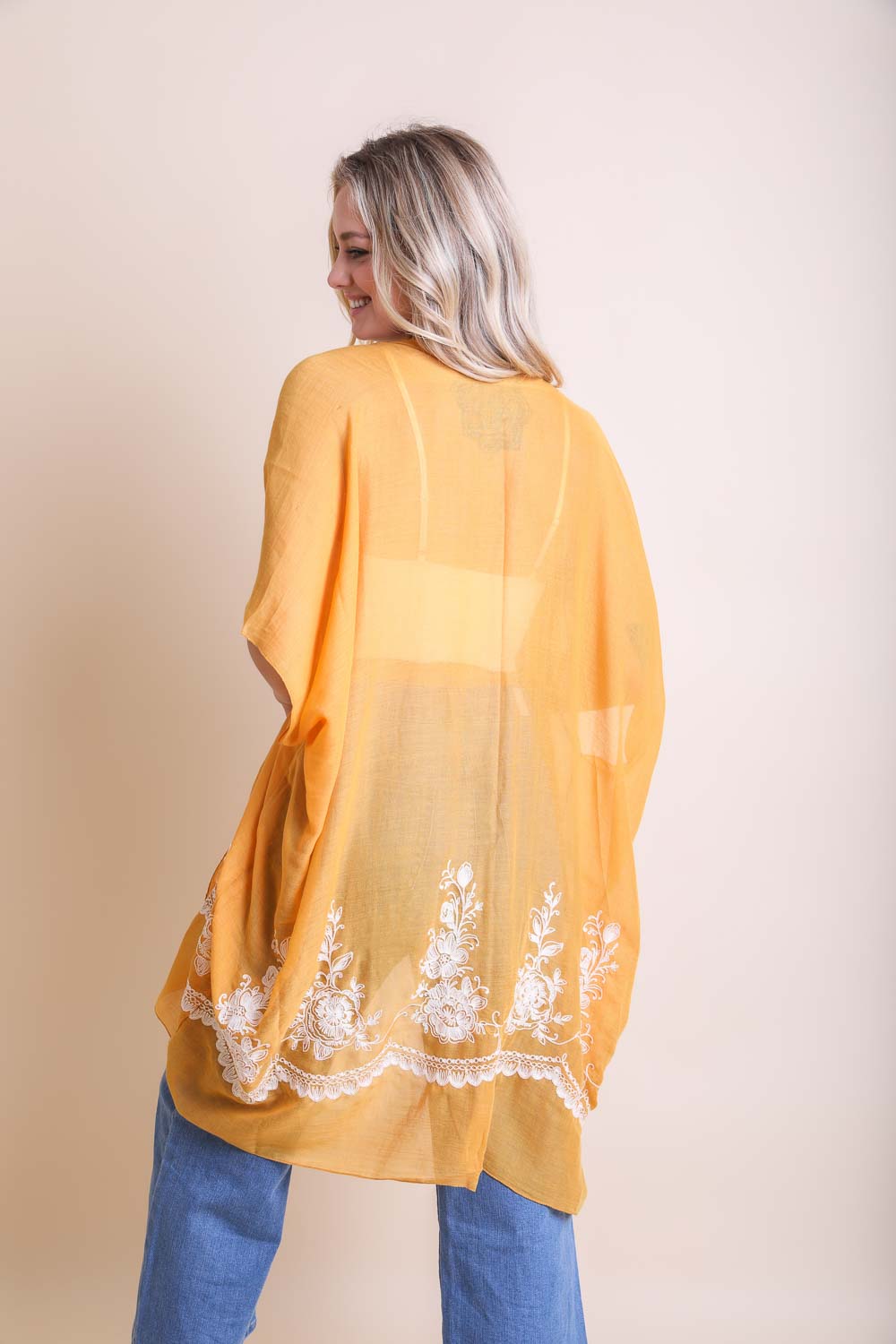 Lightweight mustard floral kimono featuring intricate embroidery details.