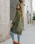 Lightweight olive floral kimono cardigan with breathable fabric.