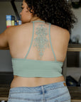 Lightweight tattoo back mesh sage bralette with soft seamless fit.