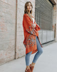 Long rust floral kimono cardigan with lightweight elegant design.