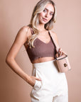 Nude sleek vegan leather waist belt bag with modern design.