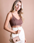 Nude trendy mini waist bag with vegan leather and gold chain.