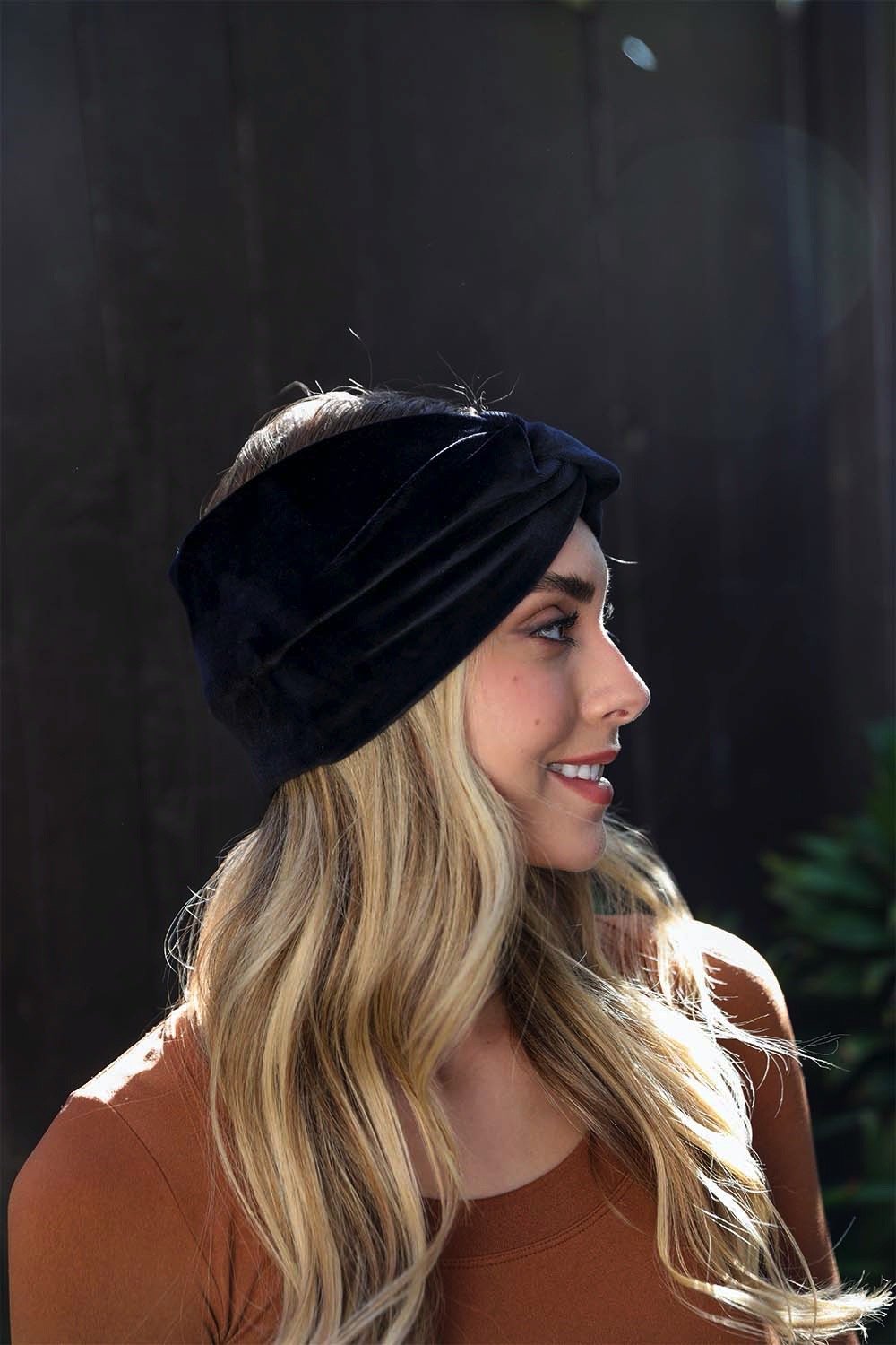 Plush and comfortable twisted black turban-style headbands.