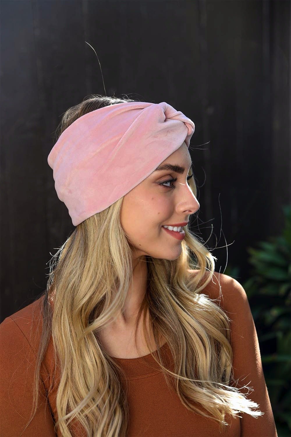 Plush twisted blush headbands for stylish and secure fit.